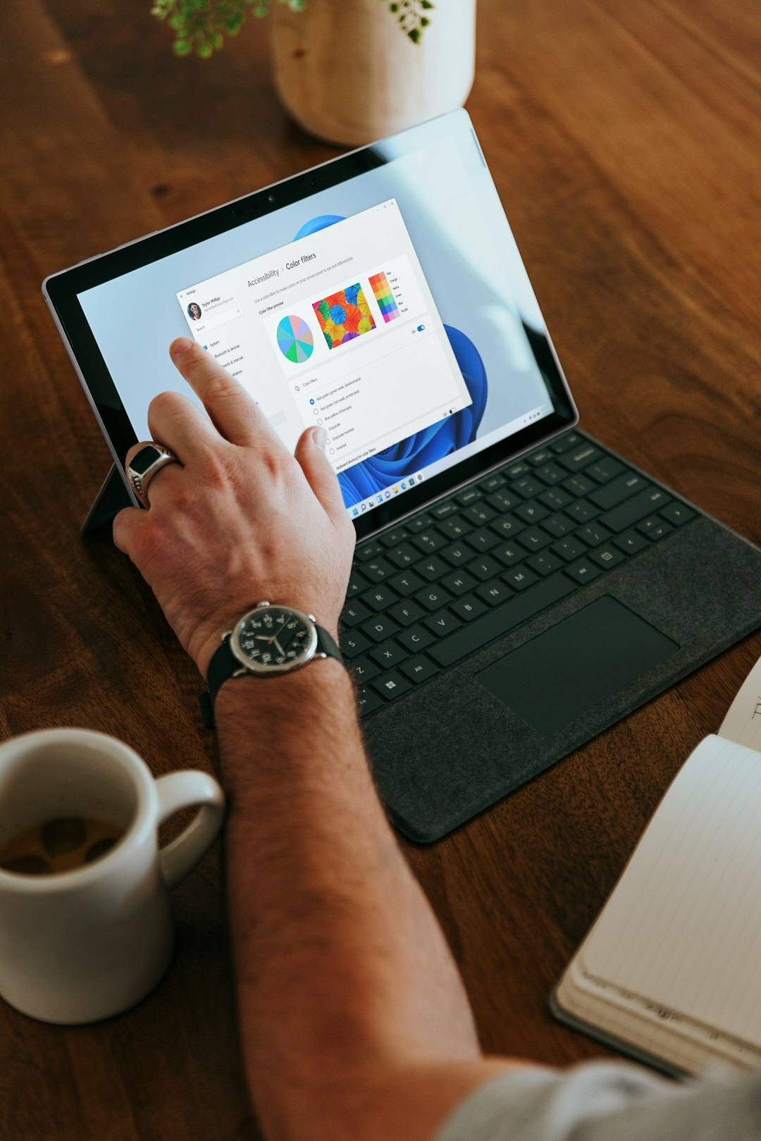 Professional reviewing digital marketing dashboard on a tablet